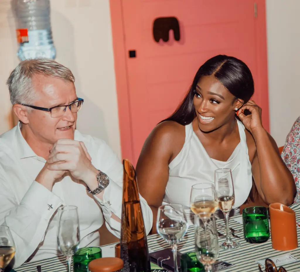 Mandy Nyarko in conversation at a dinner